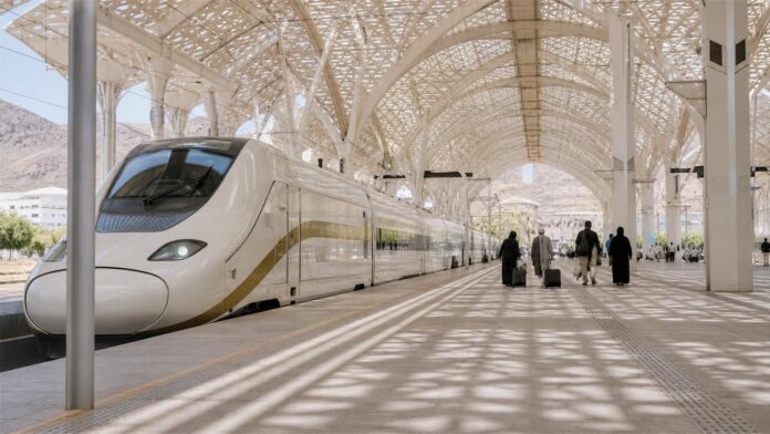 Haramain high-speed train waiting at a station platform in Saudi Arabia