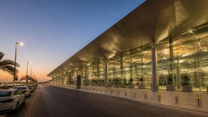 Riyadh airport terminal exterior at dusk illustrating the Indian Embassy advisory for Saudi Arabia