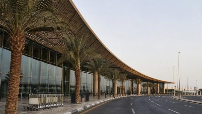 Riyadh airport suspended, quiet passenger drop-off road outside an airport terminal in Riyadh