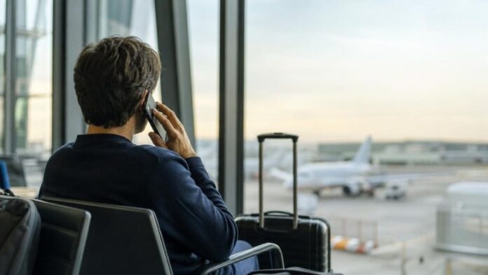 STC free roaming calls, traveller in an airport lounge phoning home to Saudi Arabia